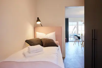 Ein Bett oder Betten in einem Zimmer der Unterkunft Kattegat Apartment 05