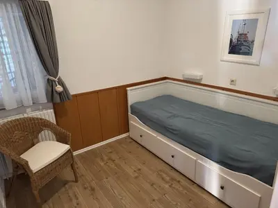 Ein Bett oder Betten in einem Zimmer der Unterkunft Haus Nordlicht I