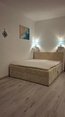 Ein Bett oder Betten in einem Zimmer der Unterkunft City-Appartement Büsum- zentral, Meer & E-Ladestation am Parkplatz
