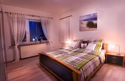 Ein Bett oder Betten in einem Zimmer der Unterkunft Die große Cuxoase FeWo 1