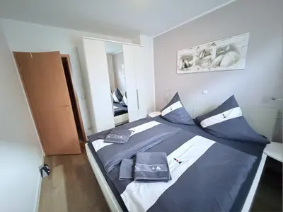 Ein Bett oder Betten in einem Zimmer der Unterkunft Hamburger Str 24 FeWo 2