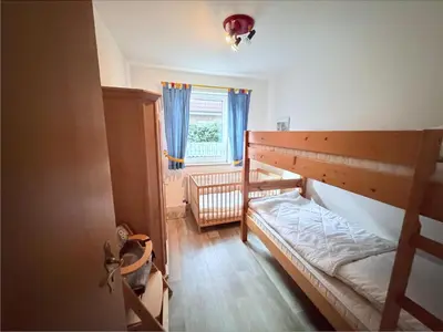 Ein Bett oder Betten in einem Zimmer der Unterkunft Hamburger Str. 24 FeWo 2