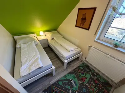 Ein Bett oder Betten in einem Zimmer der Unterkunft Ferienhaus Seedeich Lea - Friedrichskoog Nordsee