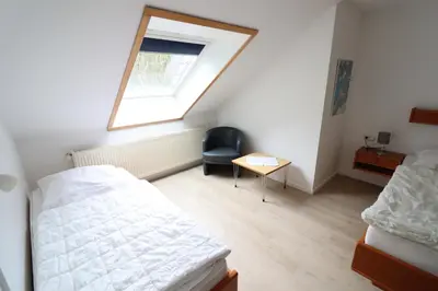Ein Bett oder Betten in einem Zimmer der Unterkunft Wohnung 2 im Haus Itjen