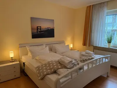 Ein Bett oder Betten in einem Zimmer der Unterkunft Strandresidenz Rosengarten, Hohenzollernstr 30, App 110