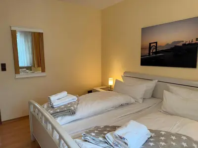 Ein Bett oder Betten in einem Zimmer der Unterkunft Strandresidenz Rosengarten, Hohenzollernstr 30, App 110