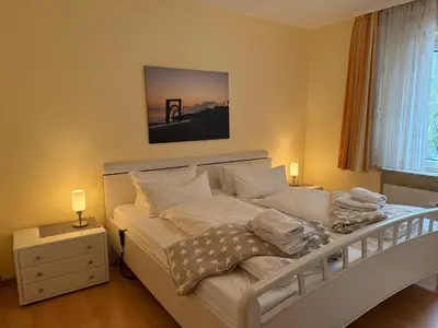 Ein Bett oder Betten in einem Zimmer der Unterkunft Strandresidenz Rosengarten, Hohenzollernstr 30, App 110