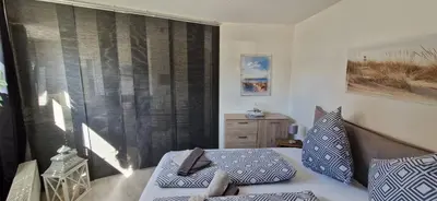 Ein Bett oder Betten in einem Zimmer der Unterkunft ToNi`s Strandbude