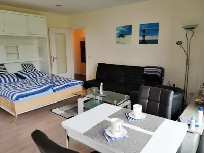Ein Bett oder Betten in einem Zimmer der Unterkunft Ferienwohnung Nordwind Büsum