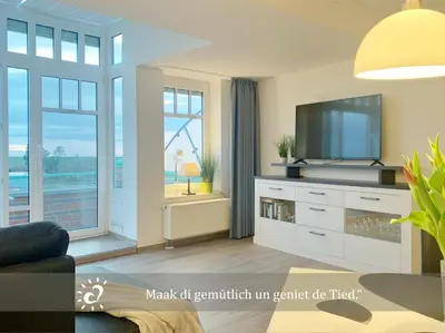 TV/Unterhaltungsangebot in der Unterkunft De Spant mit Blick auf das Wattenmeer