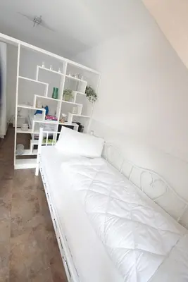 Ein Bett oder Betten in einem Zimmer der Unterkunft Kleine Muschel