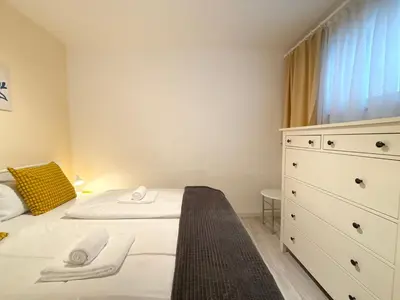 Ein Bett oder Betten in einem Zimmer der Unterkunft Poseidon FeWo 28