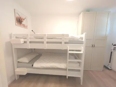 Ein Bett oder Betten in einem Zimmer der Unterkunft Terrassenhaus, FeWo 30