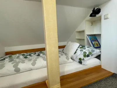 Ein Bett oder Betten in einem Zimmer der Unterkunft Ferienhaus Uferweg