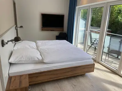 Ein Bett oder Betten in einem Zimmer der Unterkunft Gästehaus Janßen
