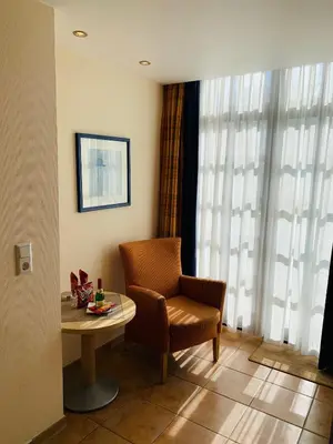 Ein Sitzbereich in der Unterkunft Aparthotel Kleine Perle