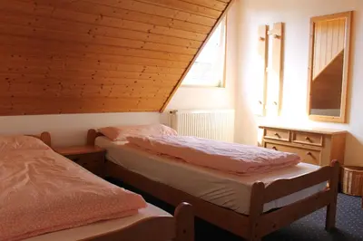 Ein Bett oder Betten in einem Zimmer der Unterkunft GLÜCKSHAUS Ferienwohnung