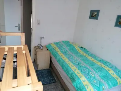 Ein Bett oder Betten in einem Zimmer der Unterkunft westerwarft 10
