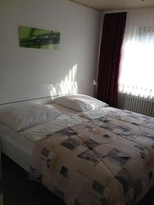 Ein Bett oder Betten in einem Zimmer der Unterkunft Andrea EG