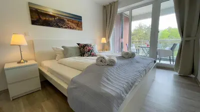 Ein Bett oder Betten in einem Zimmer der Unterkunft Strandhaus Nordseebrandung Fewo A1.5