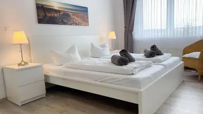 Ein Bett oder Betten in einem Zimmer der Unterkunft Strandhaus Nordseebrandung Fewo B1.1