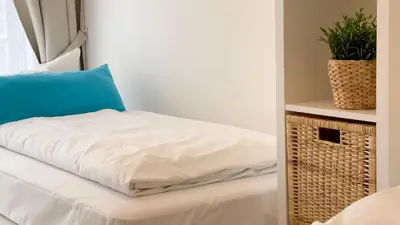Ein Bett oder Betten in einem Zimmer der Unterkunft Strandhaus Nordseebrandung Fewo B4.1