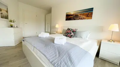 Ein Bett oder Betten in einem Zimmer der Unterkunft Strandhaus Nordseebrandung Fewo A3.3
