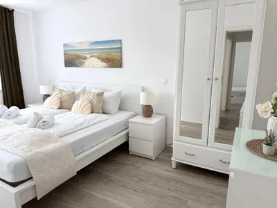 Ein Bett oder Betten in einem Zimmer der Unterkunft Strandhaus Nordseebrandung Fewo A5.1