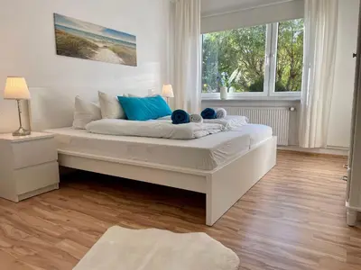 Ein Bett oder Betten in einem Zimmer der Unterkunft Haus Jenina Ferienwohnung