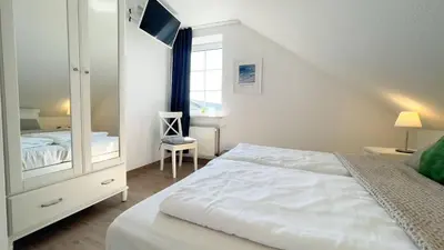 Ein Bett oder Betten in einem Zimmer der Unterkunft Haus Kirsten, Fewo Nr. 6