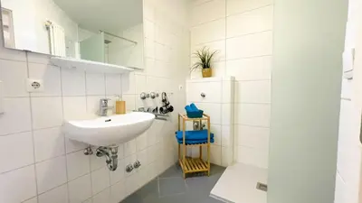Ein Badezimmer in der Unterkunft Strandhaus Nordseebrandung Fewo A3.2