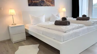 Ein Bett oder Betten in einem Zimmer der Unterkunft Strandhaus Nordseebrandung Fewo A3.2