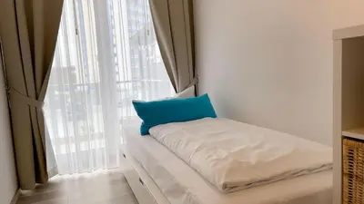 Ein Bett oder Betten in einem Zimmer der Unterkunft Strandhaus Nordseebrandung Fewo A2.1
