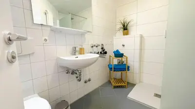 Ein Badezimmer in der Unterkunft Strandhaus Nordseebrandung Fewo C1.4