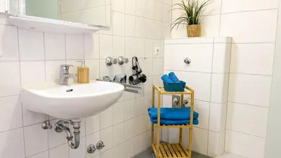 Ein Badezimmer in der Unterkunft Strandhaus Nordseebrandung Fewo C1.1