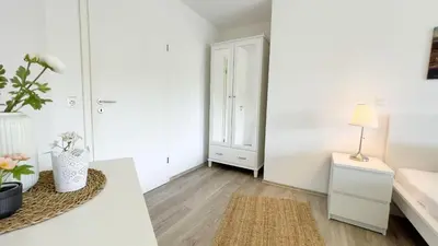 Ein Bett oder Betten in einem Zimmer der Unterkunft Strandhaus Nordseebrandung Fewo B2.3