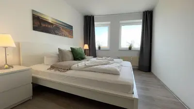 Ein Bett oder Betten in einem Zimmer der Unterkunft Strandhaus Nordseebrandung Fewo D1.4