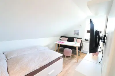 Ein Bett oder Betten in einem Zimmer der Unterkunft Appartementhaus Kogge