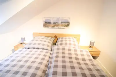 Ein Bett oder Betten in einem Zimmer der Unterkunft Haus Inge