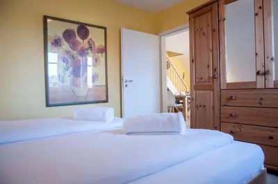 Ein Bett oder Betten in einem Zimmer der Unterkunft Hamburger Straße 7 OG