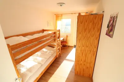 Ein Bett oder Betten in einem Zimmer der Unterkunft Haus Nordseebrandung