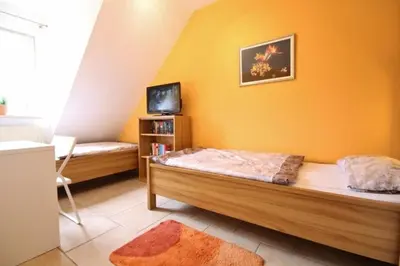Ein Bett oder Betten in einem Zimmer der Unterkunft Landhaus Hubertus, Whg 8