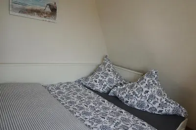Ein Bett oder Betten in einem Zimmer der Unterkunft Ferienhaus Kiebitz mit Sauna