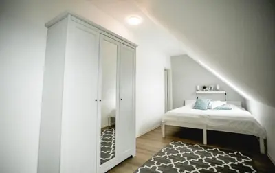 Ein Bett oder Betten in einem Zimmer der Unterkunft Ferienwohnungen in Wremen