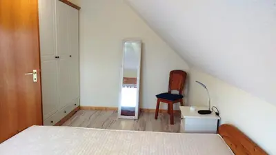 Ein Bett oder Betten in einem Zimmer der Unterkunft Haus Spitzenblick