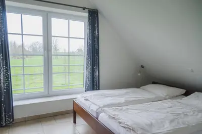 Ein Bett oder Betten in einem Zimmer der Unterkunft Der Deichhof - Ferienwohnungen