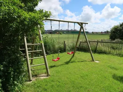Ein Kinderspielbereich in der Unterkunft Apartment Nordsee-Ferienhaus-1 by Interhome
