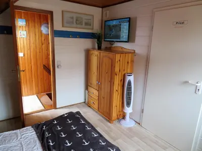 Ein Bett oder Betten in einem Zimmer der Unterkunft Ferienhäuser Seemannsgarn