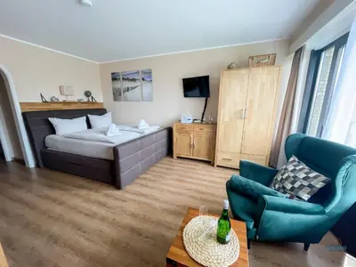 Ein Bett oder Betten in einem Zimmer der Unterkunft Urlaub in 1. Strandreihe