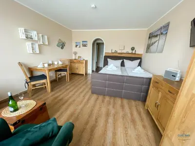 Ein Bett oder Betten in einem Zimmer der Unterkunft Urlaub in 1. Strandreihe